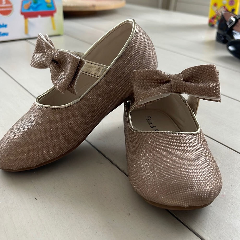 Gently worn gold bow shoes
